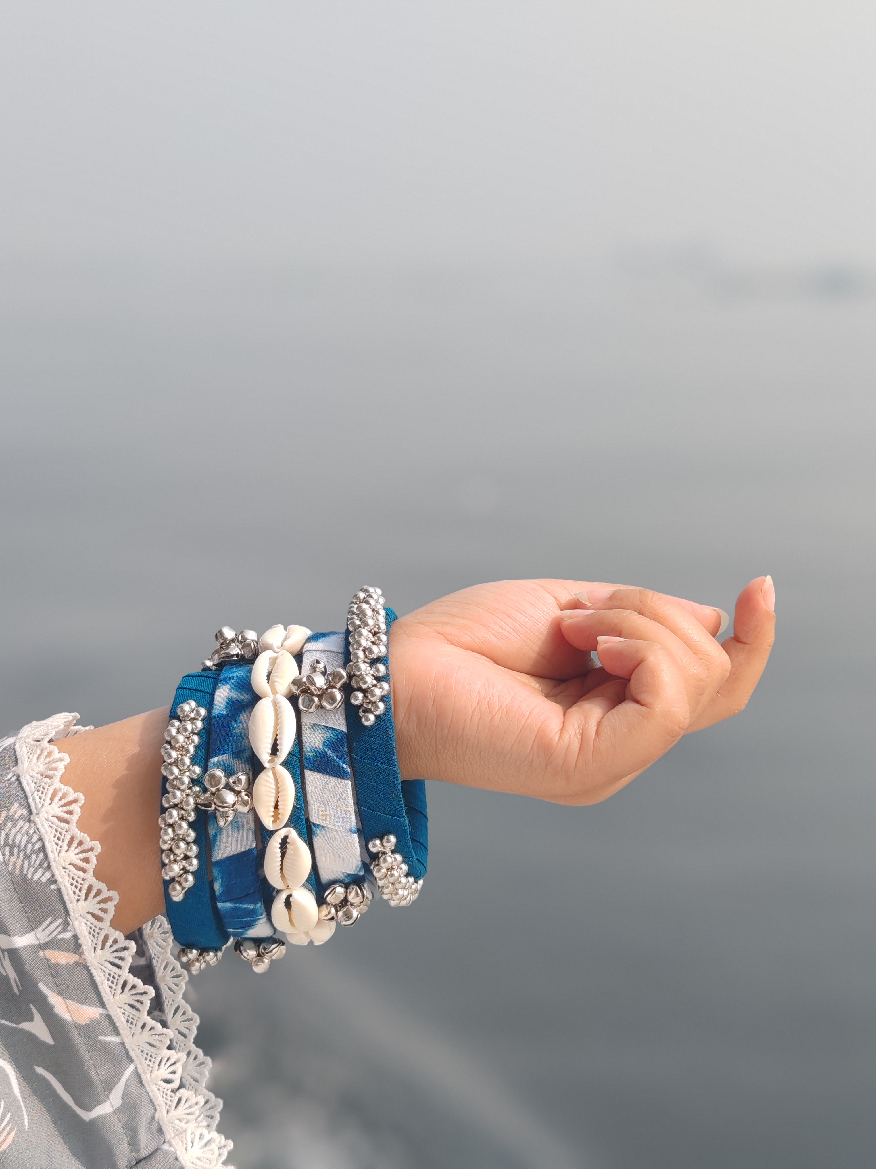 Blue cowrie shell bangles with silver beads