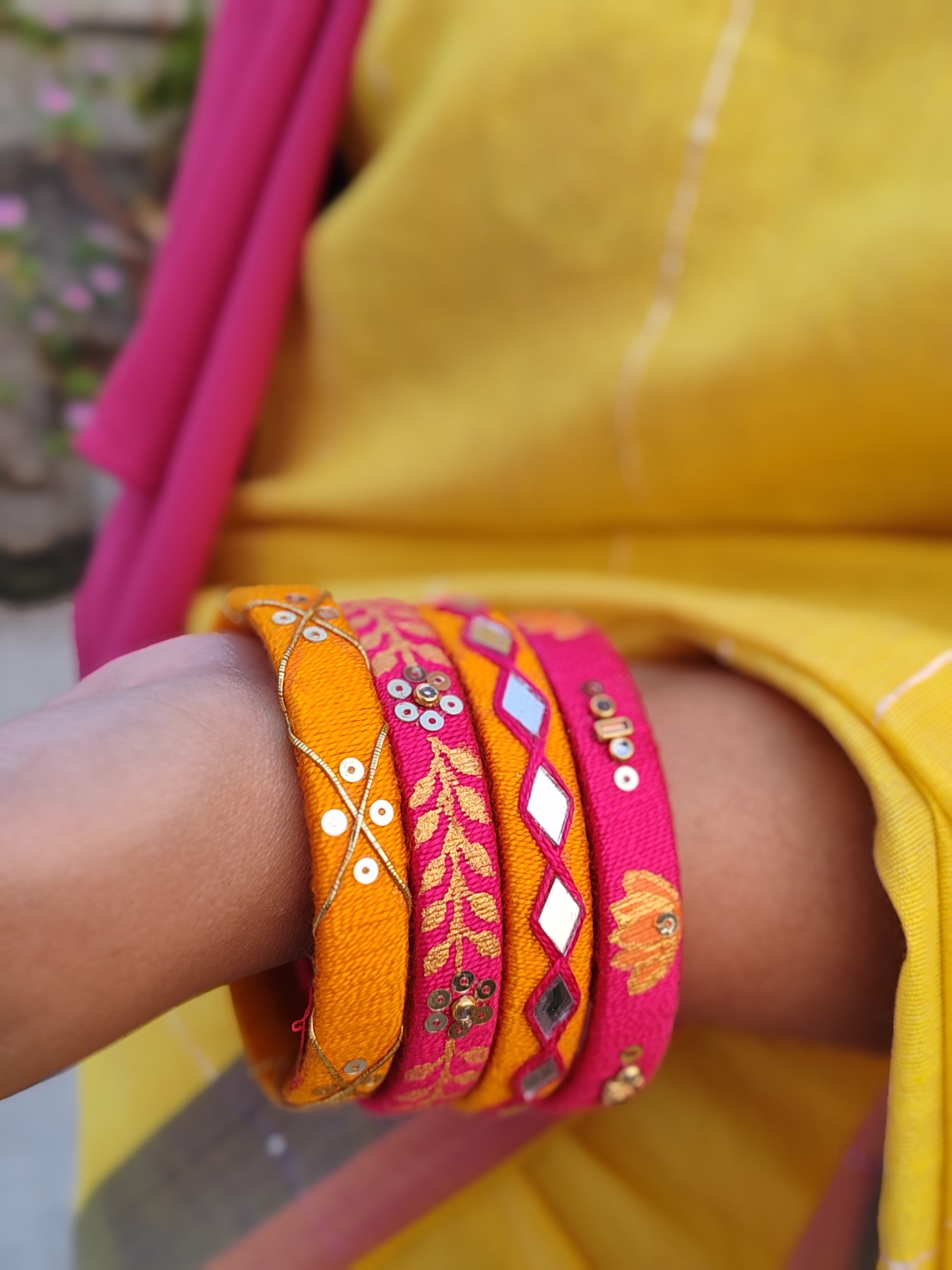 Orange embroidered bangles